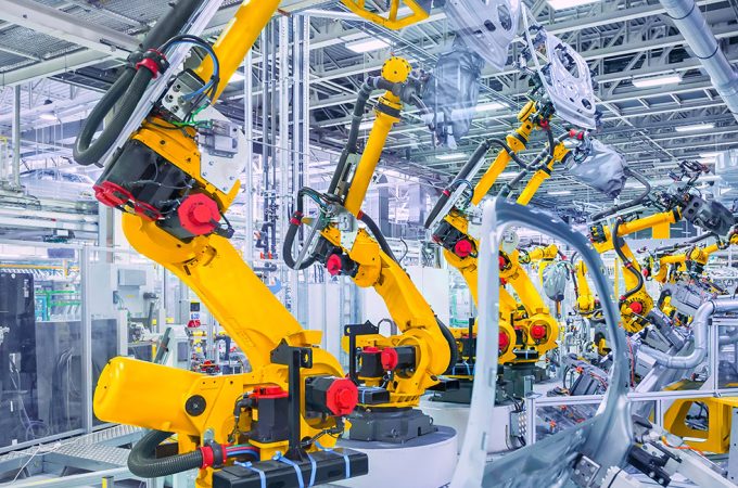 robotic arms in a car plant